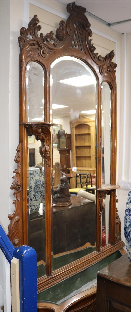 An early 20th century French carved walnut hall mirror, W.5ft H.8ft 10in.